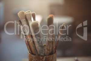 Close-up of paintbrush in pot