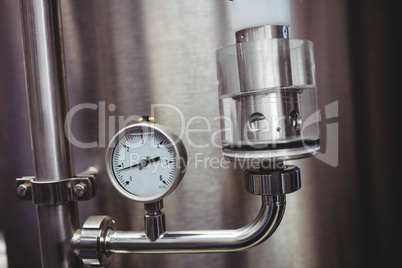Pressure gauge on storage tank in brewery