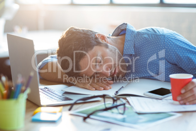 Male business executive sleeping