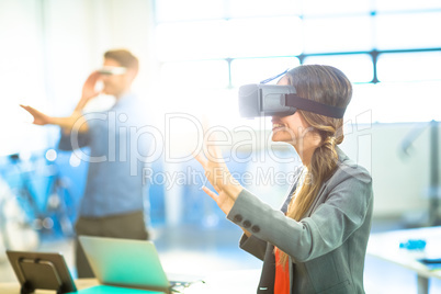 Female graphic designer using the virtual reality headset Female graphic designer using the virtual reality headset