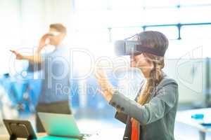 Female graphic designer using the virtual reality headset