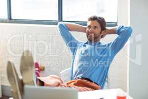 Thoughtful male business executive relaxing