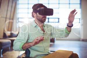 Male business executive using virtual glasses