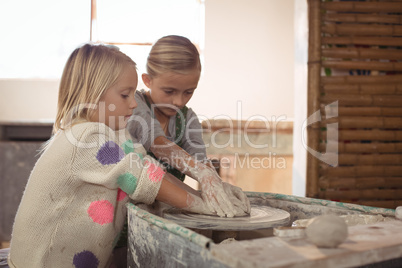 Girls making pot