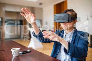 Young woman using virtual reality glasses