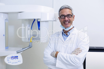 Dental dentist standing with arms crossed