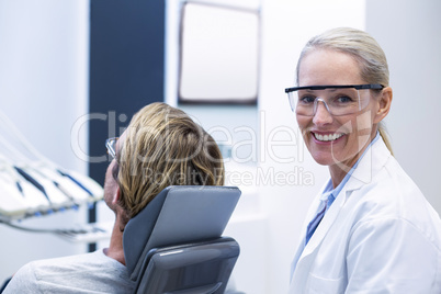 Female dentist smiling