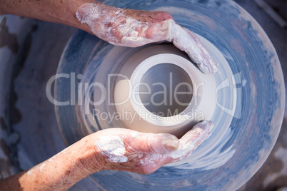 Close-up of potter making pot