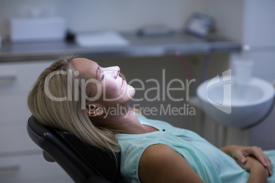 Woman relaxing on dentist chair