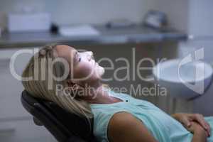 Woman relaxing on dentist chair