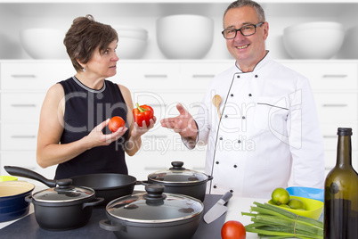 Elegant woman with Chef Cook in the kitchen