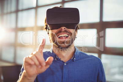 Male business executive using virtual reality headset