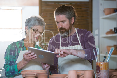 Potters using digital tablet