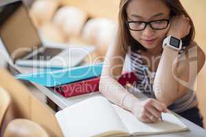 Young woman studying in classroom