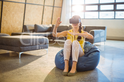 Female business executive using virtual glasses