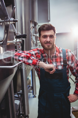 Male manufacturer standing in brewery