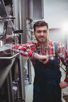 Male manufacturer standing in brewery