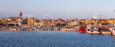 Fishing motor boat on the harbor in Palamos bay of Spain