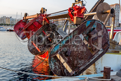 Fishing motor boat on the harbor in Palamos bay of Spain