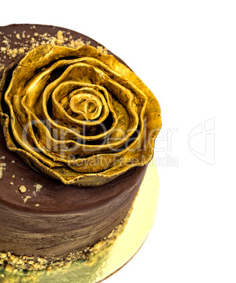 Chocolate Cake Sprinkled with Crumbs and Golden Rose