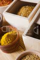 Set of spices in wooden boxes