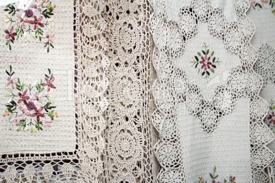 Tablecloths and napkins, decorated with embroidery and lace.