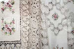 Tablecloths and napkins, decorated with embroidery and lace.
