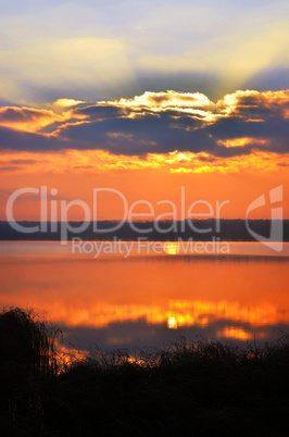 Sunrise over the lake early in the morning with beautiful clouds