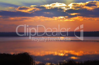 Sunrise over the lake early in the morning with beautiful clouds