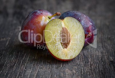 ripe plum on a wooden background