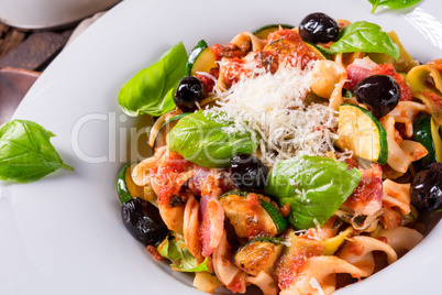 Ribbon Pasta with zucchini and olives in tomato sauce