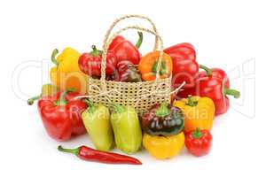 Set bell peppers in a basket isolated on a white background