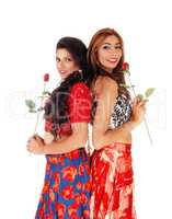Two beautiful woman holding a rose.