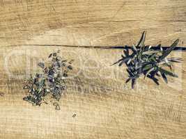 Rosemary plant on cutting board vintage desaturated