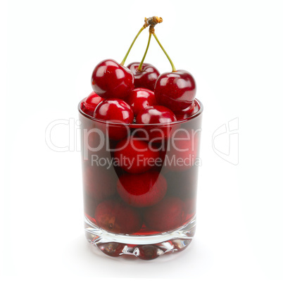 cherry and glass of juice isolated on white background