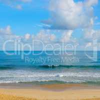 ocean, sandy beach and blue sky