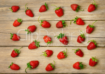 strawberries on a wooden surface background