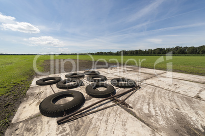 Switched tires to level out bumpy agricultural field.