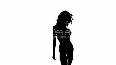 Silhouette of a sexy woman dancing isolated on white