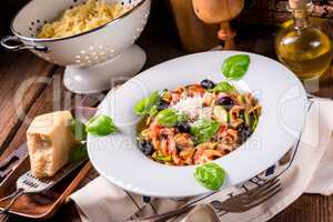 Ribbon Pasta with zucchini and olives in tomato sauce