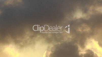 Time lapse of yellow clouds at a sunset