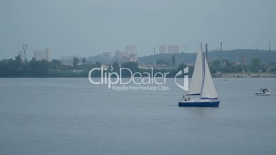 Yacht sailing on a river