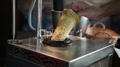Getting out baked cone from press machine