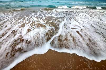 Sea beach with waves in autumn