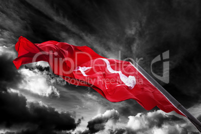 Flag of Turkey waving against black and white sky