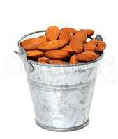 Old tin bucket with almonds