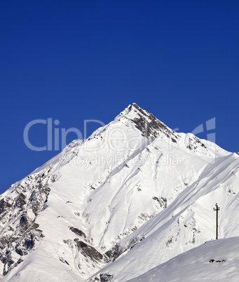 Snowy mountains and blue clear sky in nice day