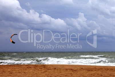 Power kite in sea and cloudy sky