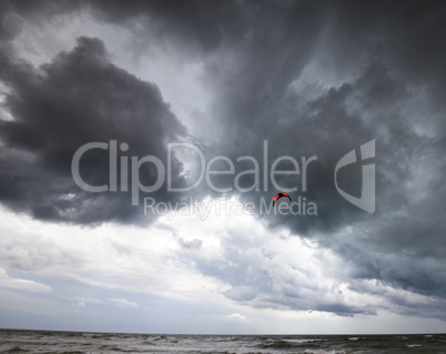 Power kite in sea and storm sky