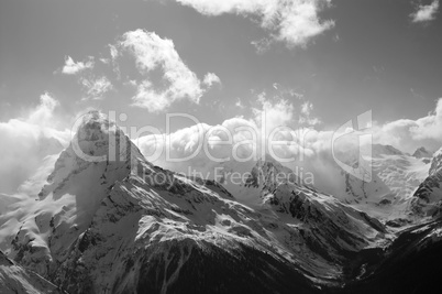 Black and white winter mountains with clouds